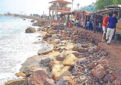 Severe coast erosion cutting down the land space near the local shops affecting the business at Rushikonda Beach in Visakhapatnam | RVK Rao