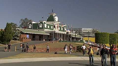 In this image made from video, tourists walk outside Dreamworld in the Gold Coast, Australia. | AP