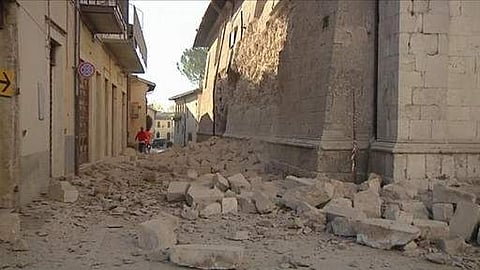 In this image made from video, bricks fallen from a damaged building block a street in Norcia, Italy | AP