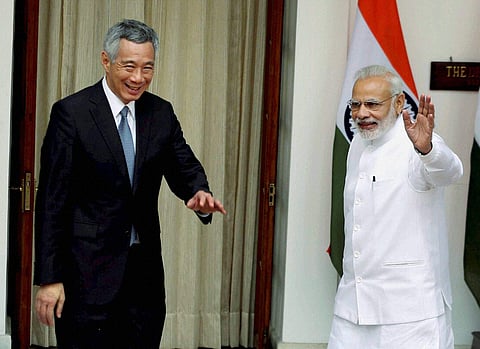 Prime Minister Narendra Modi with his Singapore counterpart Lee Hsien Loong before their meeting at Hyderabad House in New Delhi on Tuesday. | PTI