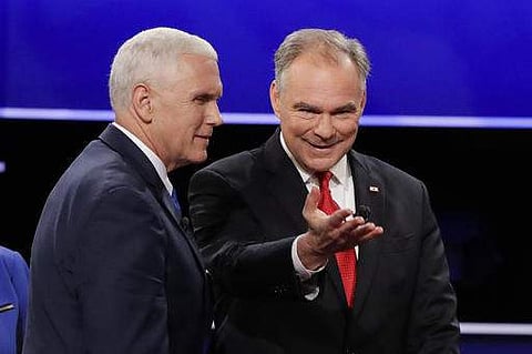 Republican vice-presidential nominee Gov. Mike Pence and Democratic vice-presidential nominee Sen. Tim Kaine walk off the stage.