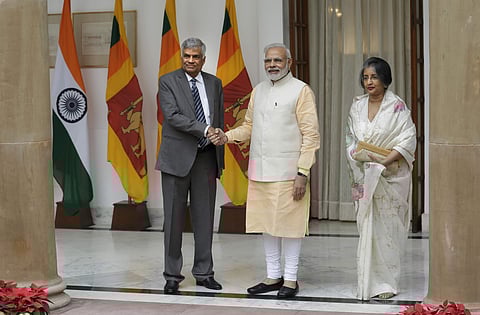 Indian Prime Minister Narendra Modi, center, poses with his Sri Lankan counterpart Ranil Wickremesinghe for a photo next to his wife Maitree Wickremasinghe in New Delhi, India. | AP