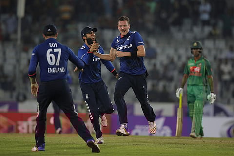 England's Jake Ball, second right, celebrate with his teammates after the dismissal of Bangladeshâs Taskin Ahmed during the first ODI match between England and Bangladesh | AP