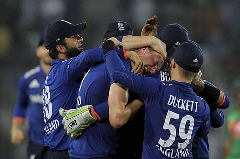 Teammates congratulate England's Jake Ball center after the dismissal of Bangladesh s Taskin Ahmed during the first one-day international. | AP
