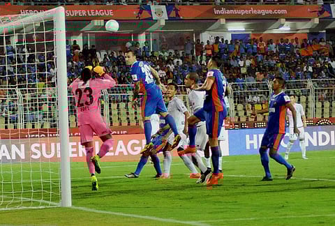 Players of FC Goa and Fc Pune City vie for the ball during their ISL match in Margao. | PTI