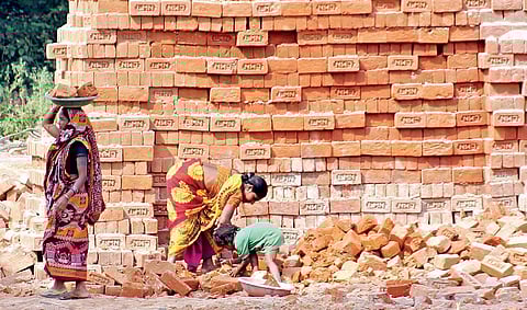 A five-year-old child working alongside her mother at a brick kiln in Ragavapur village of Pedapalli district | sathya keerthi