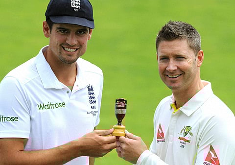 England captain Alastair Cook, left, and Australia captain Michael Clarke pose with the Ashes Trophy(File | PTI)