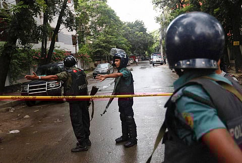 Bangladeshi policemen at the site of the bakery attack. (File Photo | AP)