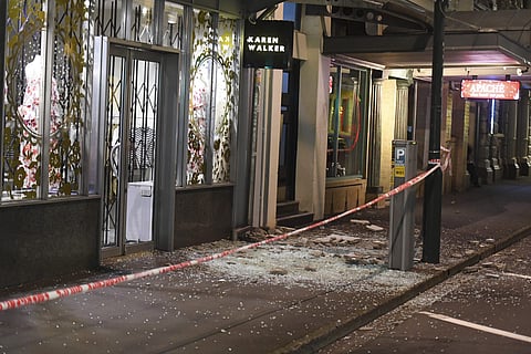 Glass and masonry litter the footpath in Wellington Monday, Nov. 14, 2016, after a major earthquake struck New Zealand's south Island | AP