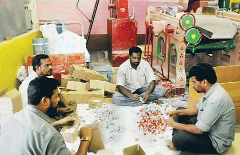 Mysore Paints and Varnish Ltd Employees bottling indelible ink in Mysuru on Wednesday