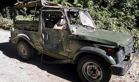 Bullet marks are seen on a damaged army vehicle at Pengeri in Assam | AFP