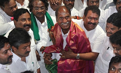 AIADMK functionaries greet AINRC supremo N. Rangasamy and other party leaders in Puducherry during an earlier election campaign.