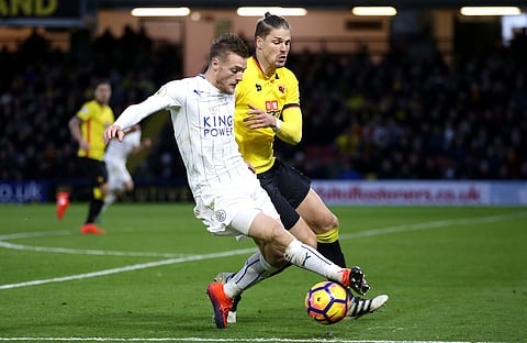 Leicester City's Jamie Vardy, left, and Watford's Sebastian Prodl battle for the ball during the English Premier League soccer match at Vicarage Road. | AP
