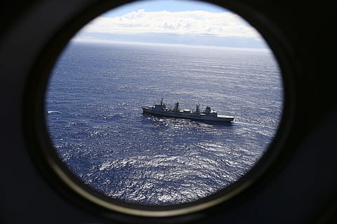 HMAS Success scans the southern Indian Ocean, near the coast of Western Australia, as a Royal New Zealand Air Force P3 Orion flies over, while searching for missing flight MH370. (Photo | AP)