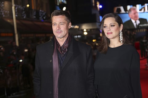 Actors Brad Pitt and Marion Cotillard pose for photographers upon arrival at the premiere of the film 'Allied' in London. | AP