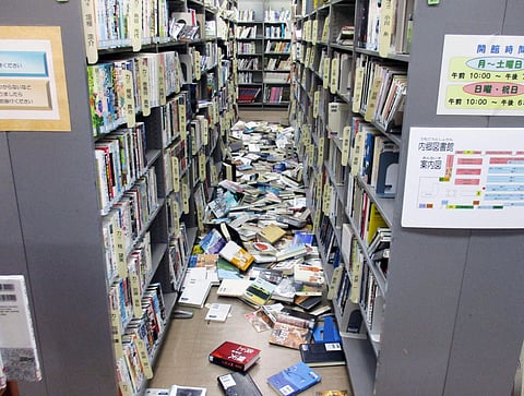 Books are scattered on the floor at a library in Iwaki, Fukushima prefecture Tuesday, Nov. 22, 2016 after a strong earthquake. | AP