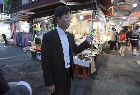 In this picture taken on Tuesday, Oct. 11, 2016, a North Korean defector Cha Ri-hyuk, 31, who came to South Korea in 2013, talks about the many markets that have opened up in North Korea. | AP