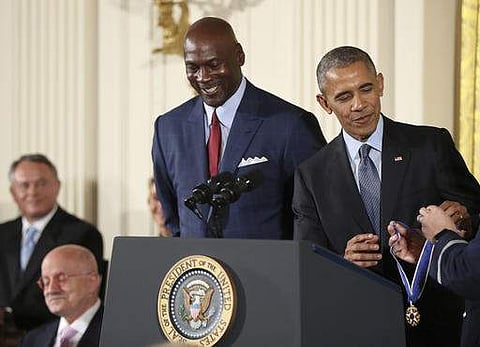 President Obama presents the Presidential Medal of Freedom to former NBA basketball player Michael Jordan on November 22. (Photo | AP)
