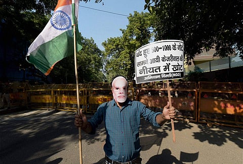 A Youth wears mask Prime Minister Narendra Modi during a protest | (File Photo/PTI)