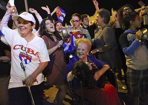 The Cuban community in Miami celebrates the announcement that Fidel Castro died in front La Carreta Restaurant, early Saturday, Nov. 26, 2016, in Miami. | AP