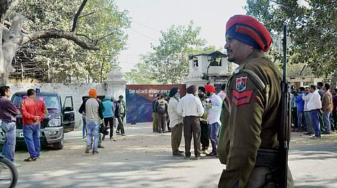 Security personnel and media representatives outside the Nabha jail in Punjab which was stormed by armed men who helped six terrorists escape, on Sunday (File | PTI)