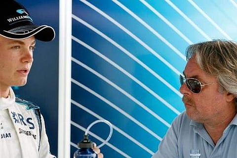 Photo taken on June 24, 2006 shows Germany's Nico Rosberg (L) talking to his father, former Formula One World Champion Keke Rosberg.(File | AFP)