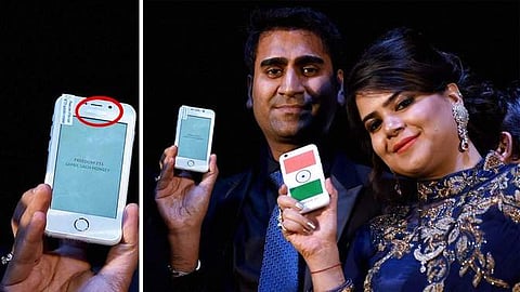Director of Ringing Bells, Mohit Goel with CEO, Dhaarna Goel during the launch event holding Freedom 251. (PTI)