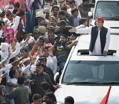 UP Chief minister Akhilesh Yadav waves at supporters during his Vikas Rath Yatra that was flagged off on Thursday in Lucknow. | PTI