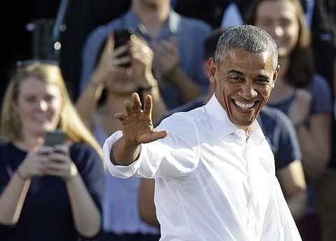 President Barack Obama greets supporters while campaigning for Hillary Clinton in Chapel Hill. (Photo | AP)