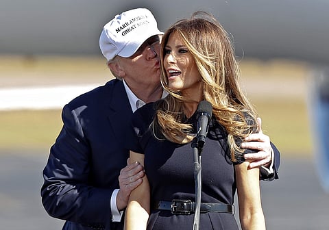 Republican presidential candidate Donald Trump kisses his wife Melania as she introduces him at a campaign rally Saturday, Nov. 5, 2016, in Wilmington, N.C. | AP
