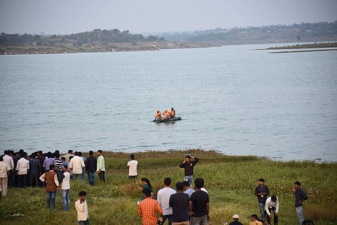 Actor Duniya Vijay sitting with rescuers after being rescued following a helicopter stunt for a Kannada film shoot that went horribly wrong in neighbouring Ramanagara district in Bengaluru. | PTI