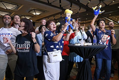 Trump supporters react as Fox News predicts Republican presidential candidate Donald Trump will carry Florida. (Photo | AP)