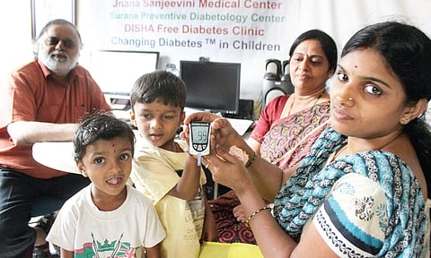 Dr S Srikanta (left) with health workers during a diabetes screening programme at the clinic in J P Nagar | s manjunath