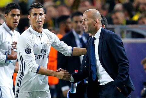 Real Madrid's Cristiano Ronaldo with Real Madrid's head coach Zinedine Zidane. |