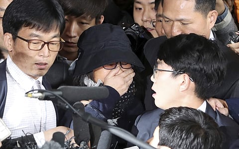 In this Oct. 31, 2016 file photo, Choi Soon-sil, center, a longtime friend of South Korean President Park Geun-hye, arrives at the Seoul Central District Prosecutors' Office in Seoul. | AP