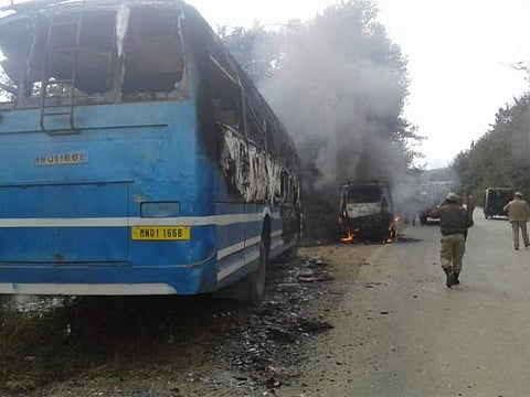 A bus and a Tata Sumo, en route Imphal, torched in Naga majority Senapati district of Manipur morning. (ENS)