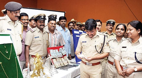 Mysuru police seized Rs 1.5 lakh cash and valuables worth Rs 57 lakh from the 11-member gang of child traffickers. | Udayashankar S