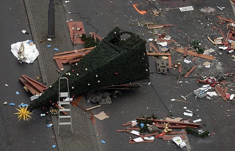 A trail of devastation is left behind in Berlin, Germany, Tuesday, Dec. 20, 2016, the day after a truck ran into a crowded Christmas market and killed several people. | AP