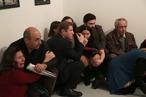 Pepole react after the the Russian Ambassador to Turkey, Andrei Karlov, was shot at a photo gallery in Ankara, Turkey, Monday, Dec. 19, 2016. | AP