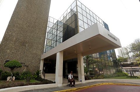 A security guard sit outside the Mossack Fonseca law firm in Panama City. |AP