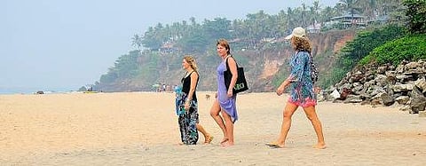 Tourists at the Varkala Papanasam beach B P Deepu