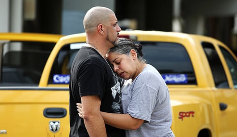 Ray Rivera, left, a DJ at Pulse Orlando nightclub, is consoled by a friend, outside of the Orlando Police Department after a shooting involving multiple fatalities at the nightclub. (File|AP)