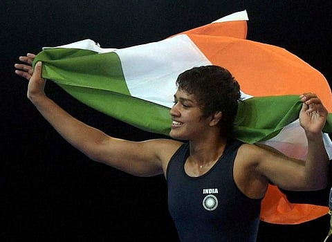 India's Babita Kumari celebrates after winning the gold medal against Canada's Brittanee Laverdure during the women's Freestyle Wrestling 55kg Final match during the Commonwealth Games 2014 in Glasgow, Scotland. (File|PTI)