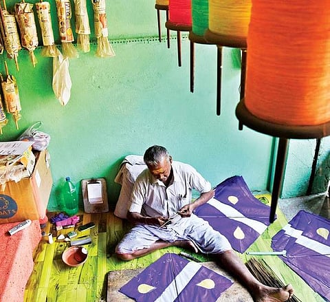 A retired government employee busy making kites as part of his family business for the upcoming Sankranti festival at Dhoolpet in Hyderabad | Vinay Madapu