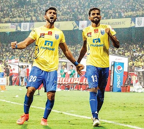 it’s all yellow Kerala Blaster’s CK Vineeth (R) and Mohammed Rafi celebrate after their win | K shijith