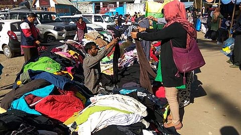 Buyers carefully select their purchases at a second-hand market in Kohima, Nagaland on December 5. (Photo | Aishik Chanda)