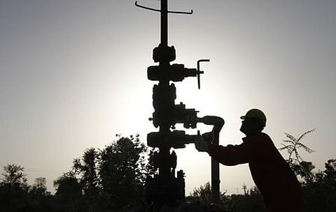 A technician opens a pressure gas valve inside the Oil and Natural Gas Corp (ONGC) group gathering station on the outskirts of Ahmedabad in March 2012. (File Photo | Reuters)