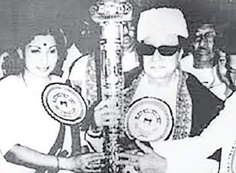 MGR handing over the sceptre to J Jayalalithaa during the AIADMK’s Madurai conference in 1986