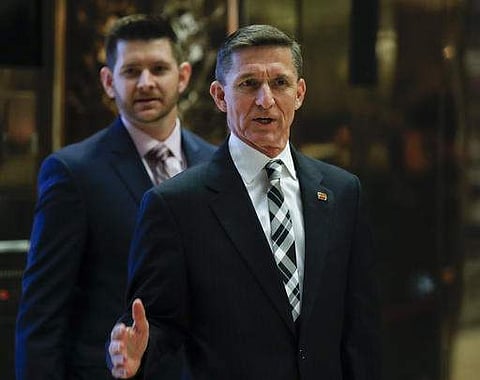 this Nov. 17, 2016 file photo, Retired Lt. Gen Michael Flynn talks to media as he arrives with is son Michael G. Flynn, left, at Trump Tower in New York. (Photo | AP)