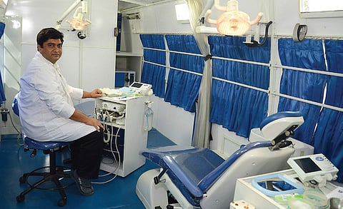 Dr Devaiah inside the mobile van